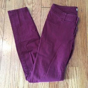 Hollister burgundy skinny jeans.
